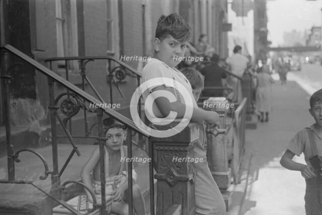 Children playing in the street, 61st Street between 1st and 3rd Avenues, 1938. Creator: Walker Evans.
