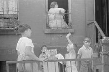 Children playing in the street, 61st Street between 1st and 3rd Avenues, New York, 1938. Creator: Walker Evans