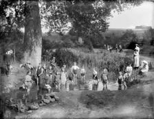 Children playing in a pool on a hot summer's day, Cowley, Oxford, Oxfordshire, 1914. Artist: Henry Taunt