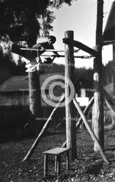 Children playing on a climbing frame, Bistrita Valley, Moldavia, north-east Romania, c1920-c1945. Artist: Adolph Chevalier