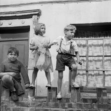 Children playing on a wall, London, 1960-1965. Artist: John Gay