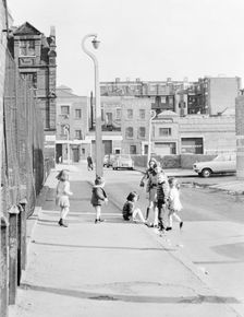 Children playing on Hopetown Street, London. Creator: Willson