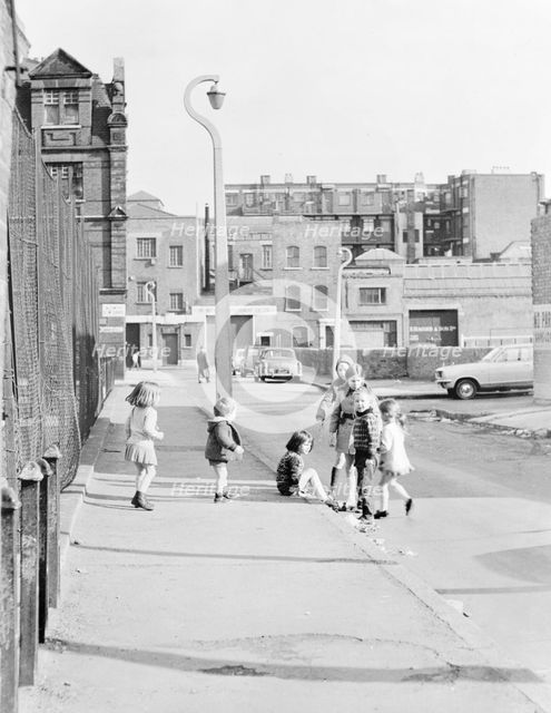 Children playing on Hopetown Street, London. Creator: Willson.