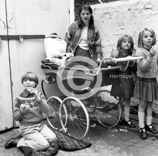 Children playing 'Penny for the Guy' in a London yard, Oct 1978. Creator: Henry Grant.