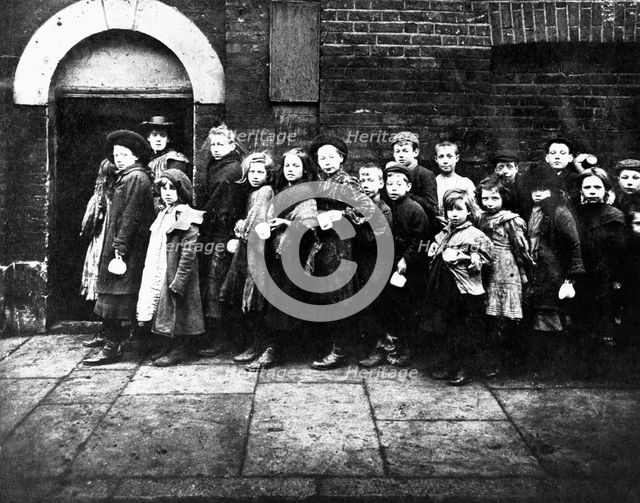 Children queuing for farthing breakfast, Hanbury Street, London. Creator: Unknown.
