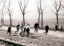Children running alongside a canal, Monnickendam, Netherlands, 1898.Artist: James Batkin