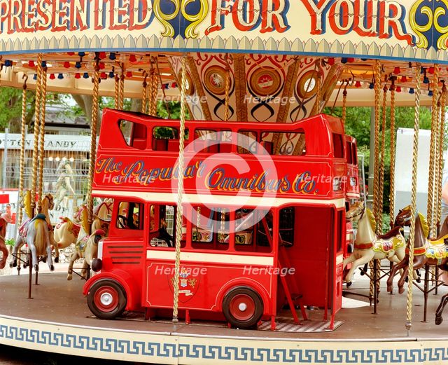 Children's carousel at a funfair in Street, Somerset, c2000.  Artist: M Hesketh-Roberts