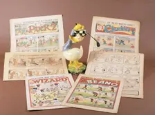 Children's comics with golfing theme, and Donald Duck figurine, c1950s-1960s. Creator: Unknown