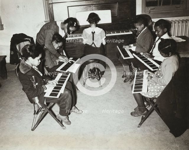 Children's piano class, Central Manhattan Music School, 1938. Creator: Solomon Horn.