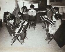Children's piano class, Central Manhattan Music School, 1938. Creator: Solomon Horn