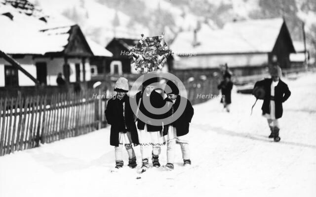Children walking in the snow, Bistrita Valley, Moldavia, north-east Romania, c1920-c1945. Artist: Adolph Chevalier
