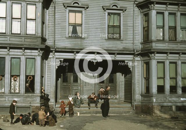 Children with adult in the tenement district, Brockton, Massachusetts, 1940. Creator: Jack Delano.