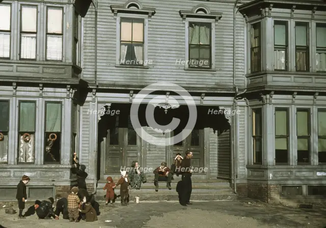 Children with adult in the tenement district, Brockton, Massachusetts, 1940. Creator: Jack Delano.