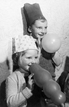 Children with balloons, c1955. Creator: Arthur Charles Kirby Ware