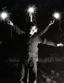 Children with fireworks, c1955. Creator: Arthur Charles Kirby Ware