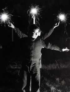 Children with fireworks, c1955. Creator: Arthur Charles Kirby Ware