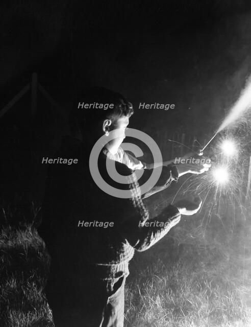 Children with fireworks, c1955. Creator: Arthur Charles Kirby Ware.