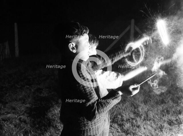Children with fireworks, c1955. Creator: Arthur Charles Kirby Ware.