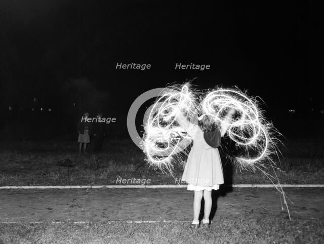 Children with fireworks, c1955. Creator: Arthur Charles Kirby Ware.