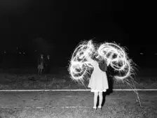 Children with fireworks, c1955. Creator: Arthur Charles Kirby Ware