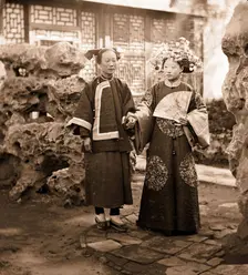 China: a Manchu bride in her wedding clothes with her maid, Beijing, 1869. Creator: John Thomson