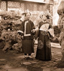 China: a Manchu bride in her wedding clothes with her maid, Beijing, 1869. Creator: John Thomson