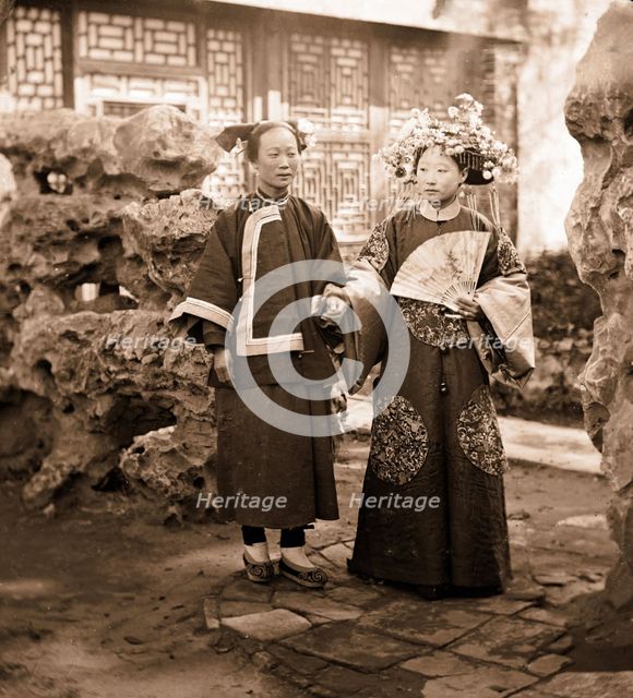 China: a Manchu bride in her wedding clothes with her maid, Beijing, 1869. Creator: John Thomson.