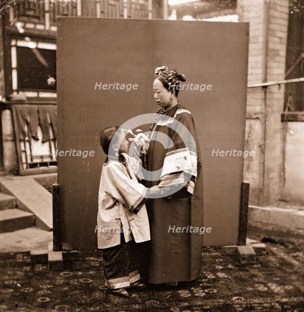 China: a Manchu lady with a child, Beijing, 1869. Creator: John Thomson.