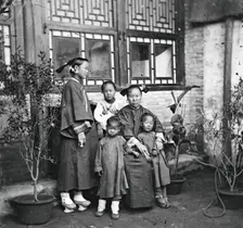 China: a Manchu lady with her daughter in-law and grandchildren, Beijing, 1869. Creator: John Thomson