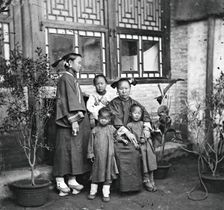 China: a Manchu lady with her daughter in-law and grandchildren, Beijing, 1869. Creator: John Thomson