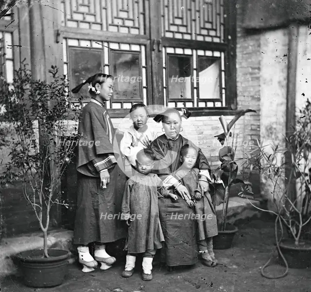 China: a Manchu lady with her daughter in-law and grandchildren, Beijing, 1869. Creator: John Thomson.