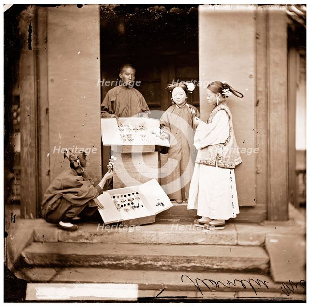 China: Manchu women buying flowers for their headdress, Beijing, 1869. Creator: John Thomson.