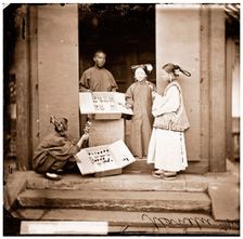 China: Manchu women buying flowers for their headdress, Beijing, 1869. Creator: John Thomson