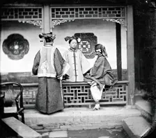 China: three Manchu ladies inside a courtyard, Beijing, 1869. Creator: John Thomson