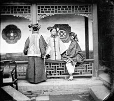 China: three Manchu ladies inside a courtyard, Beijing, 1869. Creator: John Thomson
