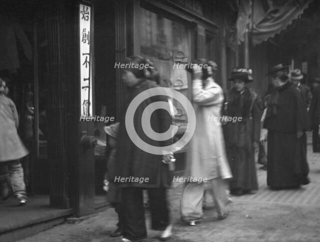 Chinese and American women walking down a street, Chinatown, San Francisco, between 1896 and 1906. Creator: Arnold Genthe.