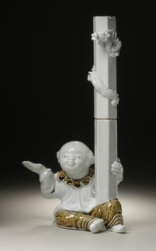 Chinese Boy (karako) Holding Candlestick with Raised Dragon, 19th century. Creator: Unknown