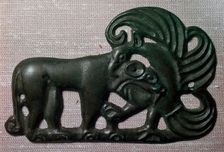 Chinese bronze harness plaque of a tiger and gryphon, 2nd century BC
