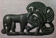 Chinese bronze harness plaque of a tiger and gryphon, 2nd century BC