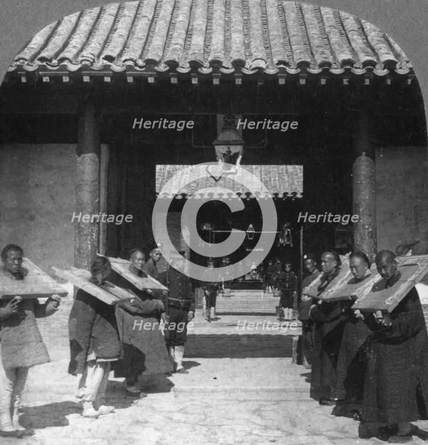 'Chinese criminals in the Viceroy's Yamen, now used as a jail', Tientsin (Tianjin), China, 1901. Artist: The Fine Art Photographers Co