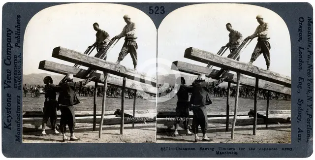 Chinese men sawing timber for the Japanese army, Manchuria, Russo-Japanese war, 1904-1905.Artist: Keystone