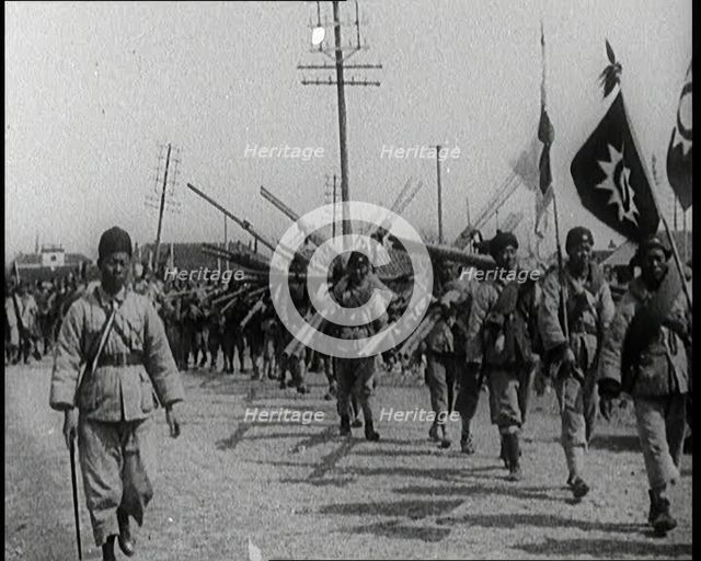 Chinese Soldiers Marching Carrying Flags and Other Equipment, 1920s. Creator: British Pathe Ltd.