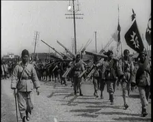 Chinese Soldiers Marching Carrying Flags and Other Equipment, 1920s. Creator: British Pathe Ltd