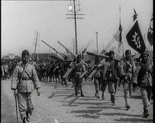 Chinese Soldiers Marching Carrying Flags and Other Equipment, 1920s. Creator: British Pathe Ltd