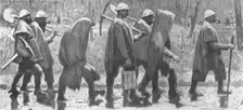 'Choses vues a la guerre; territoriaux revenant de corvee sous la pluie. 1915. Creator: Georges Leroux