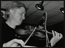 Christian Garrick playing the violin at The Fairway, Welwyn Garden City, Hertfordshire, 2000. Creator: Denis Williams