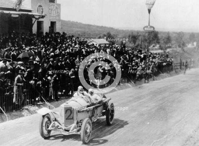 Christian Lautenschlager passing the tribunes, in the Targa Florio race, Sicily, 1922. Artist: Unknown