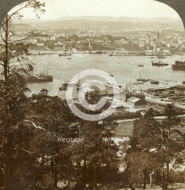 'Christiania and her busy harbor, N.W. from the Ekeberg (Royal Palace at right), Norway', c1905. Creator: Unknown.
