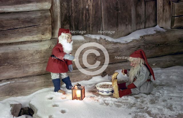 Christmas brownies getting their christmas porridge, 1960s. Artist: Göran Algård