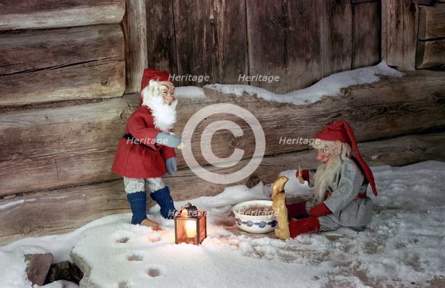 Christmas brownies getting their christmas porridge, 1960s. Creator: Göran Algård.